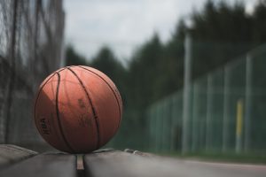 macro photography of brown NBA basketball ball on concrete surface